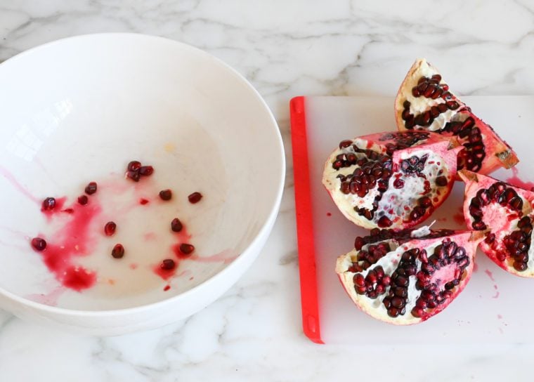 pulling apart pomegranate quarters