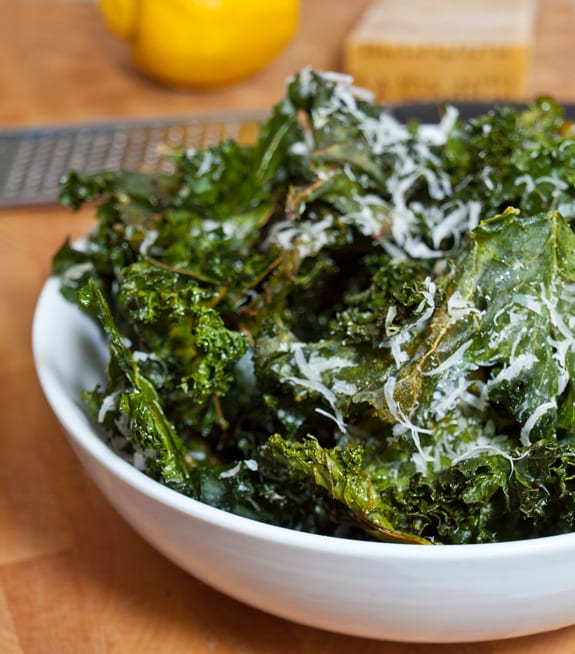 Bowl of kale chips with lemon and parmesan.