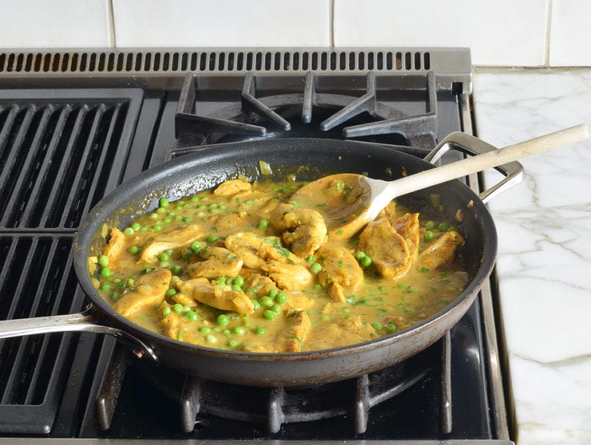 Chicken curry in a skillet.
