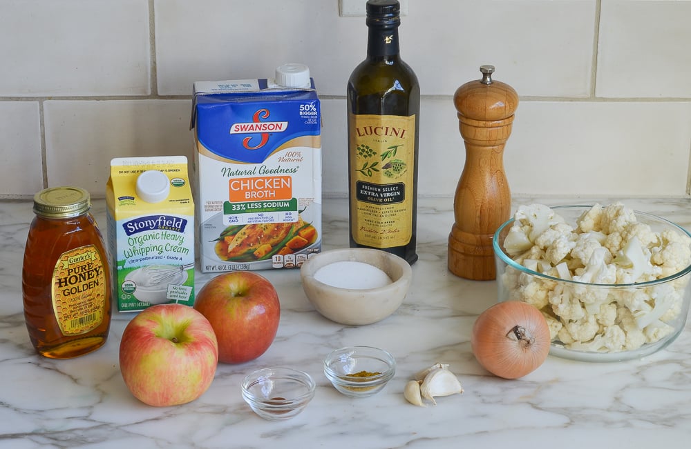 Soup ingredients including apples, whipping cream, and onion.