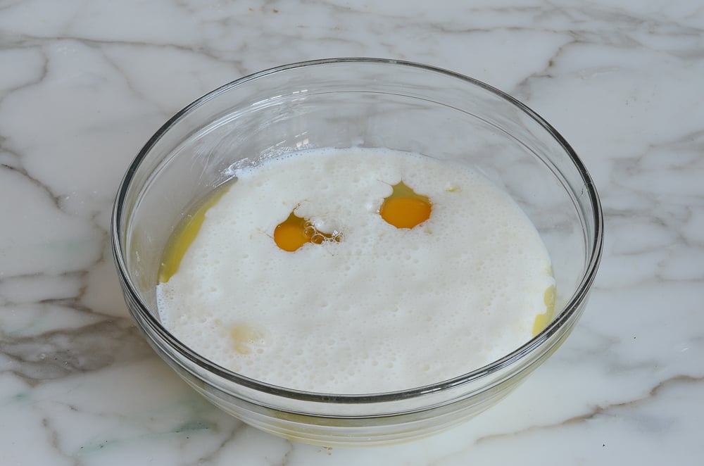 Bowl with butter, buttermilk, and eggs.