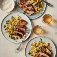 Plates of grilled Moroccan chicken.