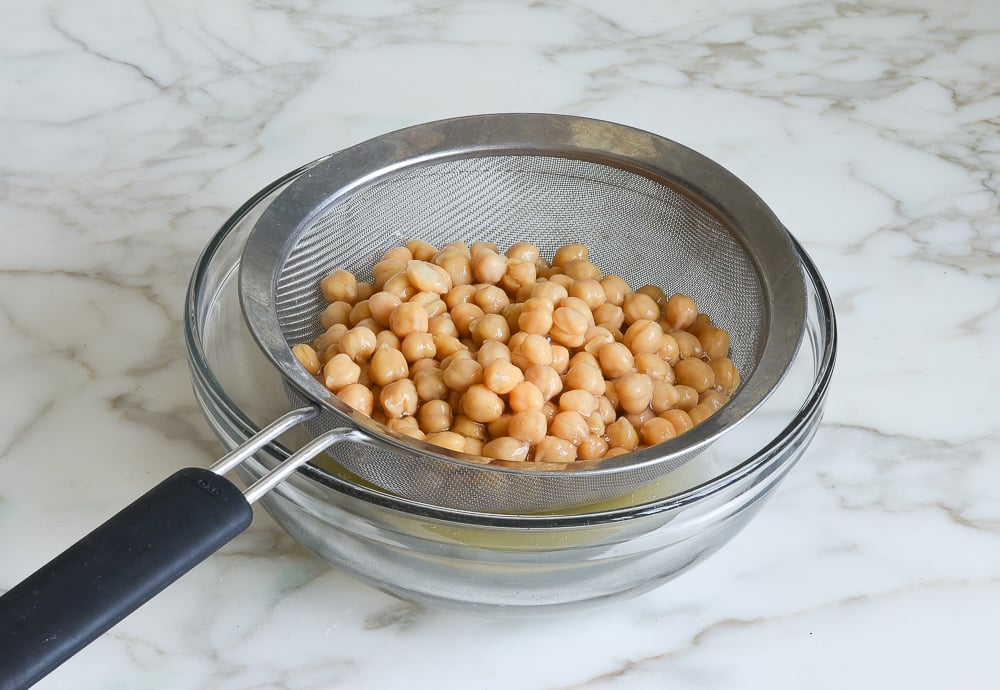 Draining the chickpeas