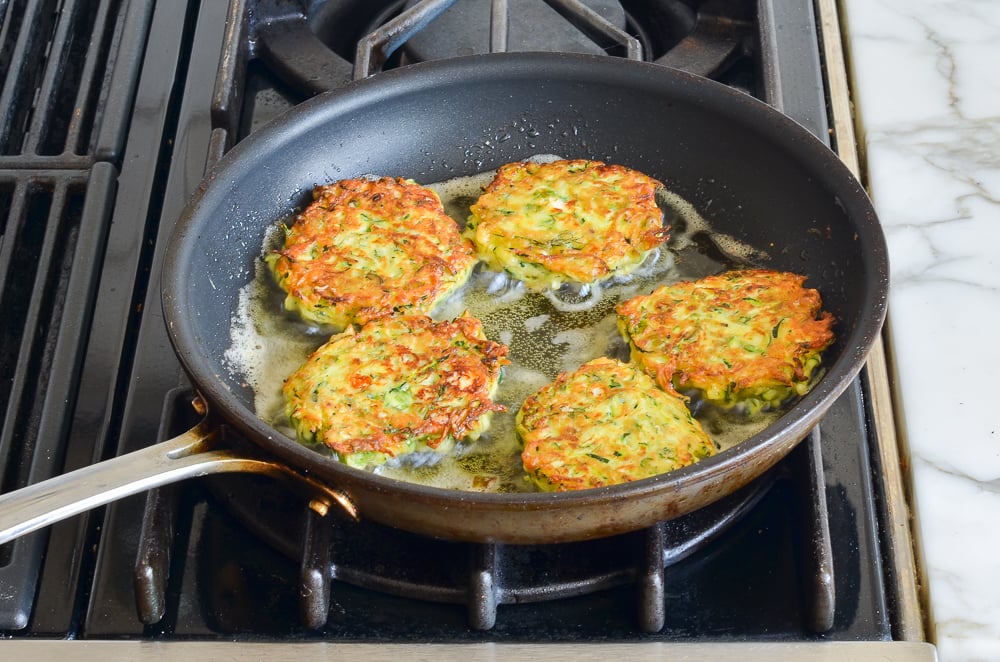 pan-frying the zucchini fritters