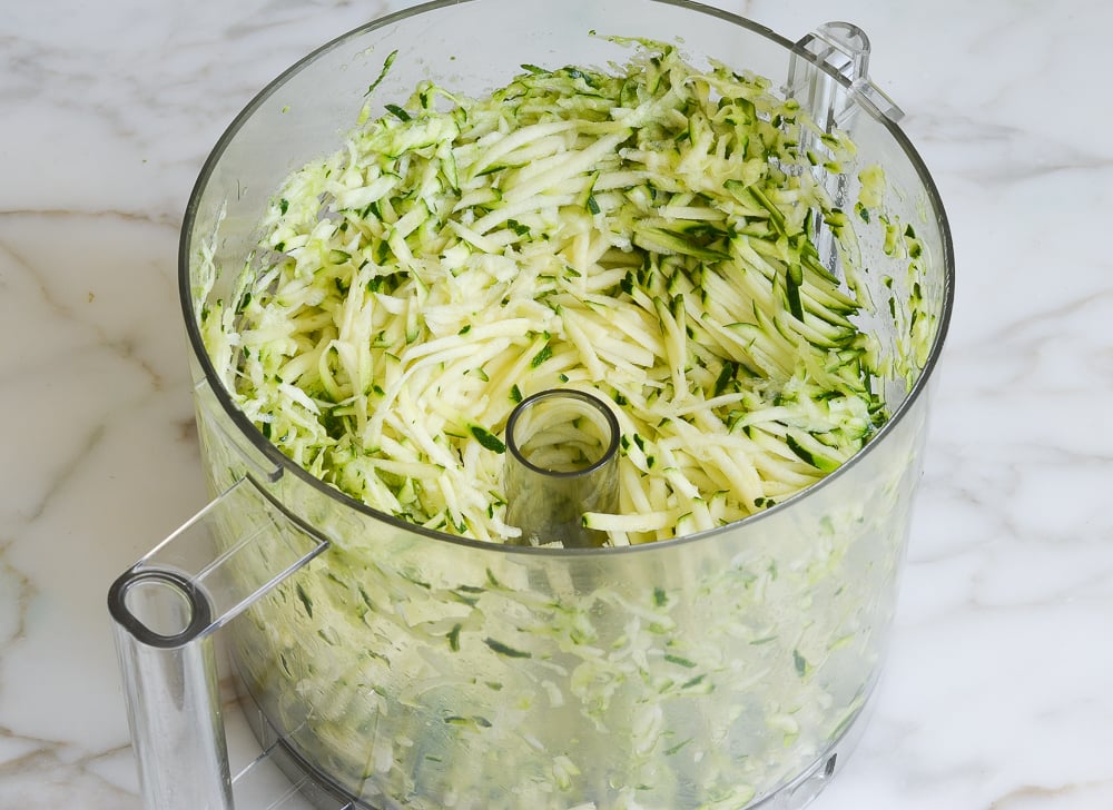 Food processor of shredded zucchini.