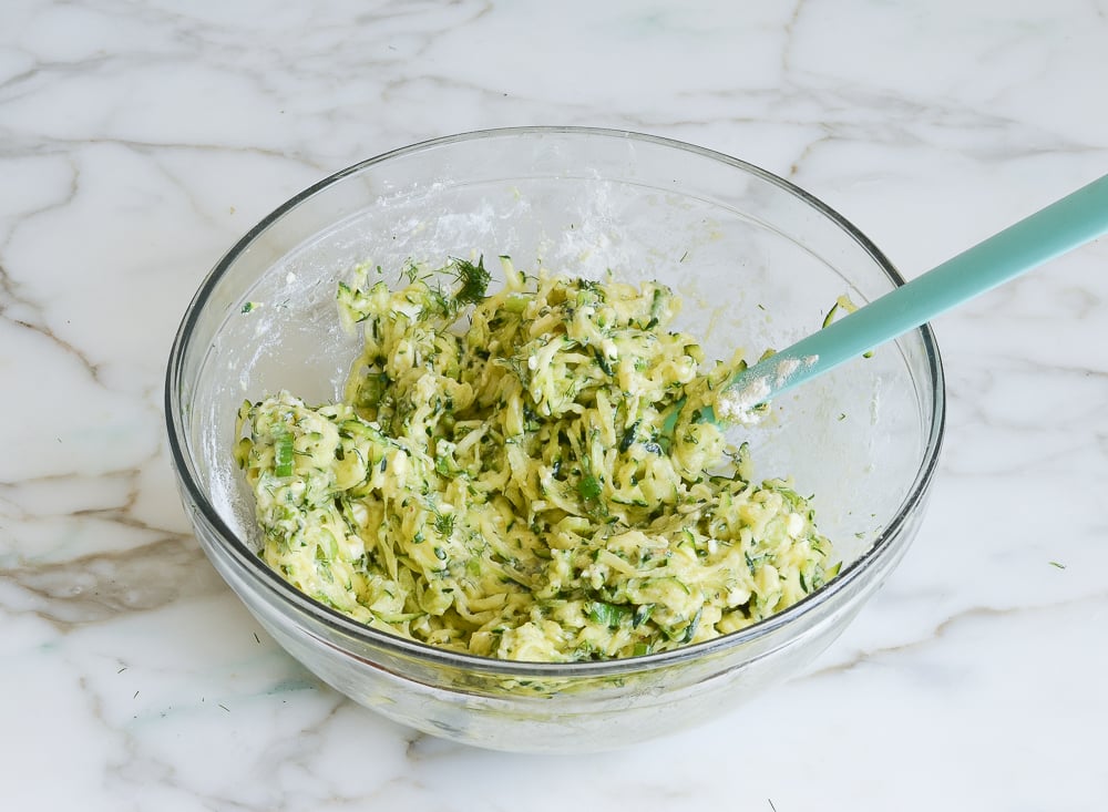 finished zucchini fritter mixture in bowl