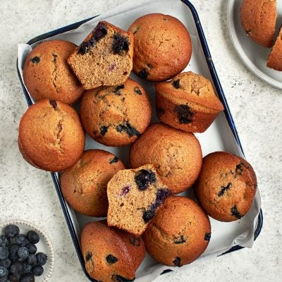 blueberry maple bran muffins on baking tray