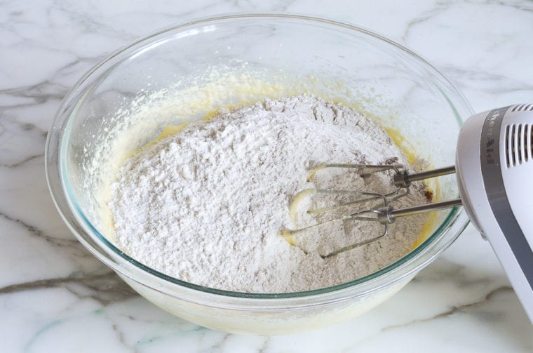 Dry ingredients in a bowl with a butter mixture.