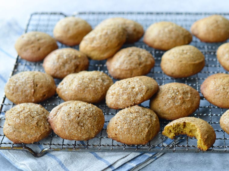 Spiced pumpkin cookies on a wire rack.