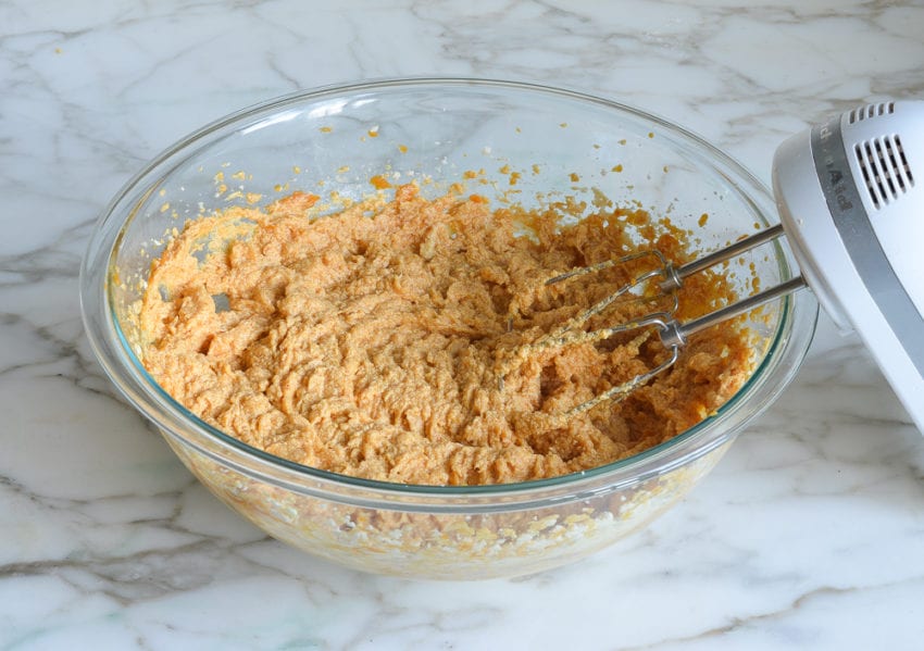 Bowl of light orange ingredients.