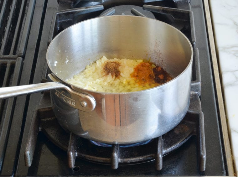 adding garlic and spices