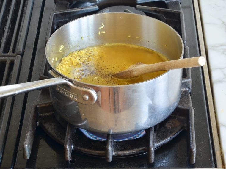adding the water and seasoning