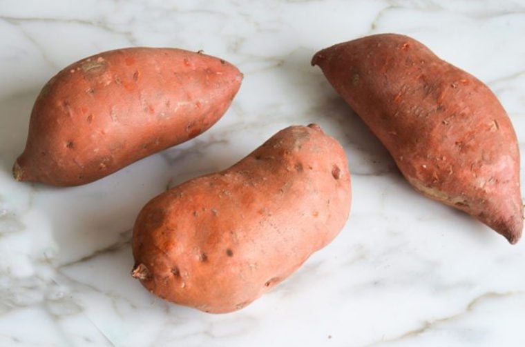 Sweet potatoes on a counter.