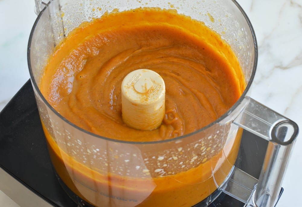 Burnt orange mixture in a food processor.