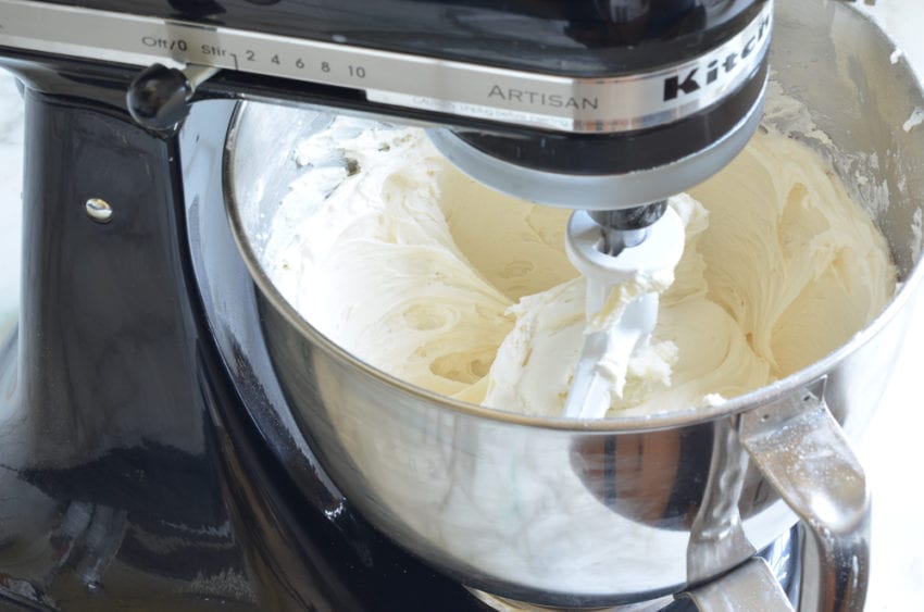 Vanilla buttercream in the bowl of a stand mixer.