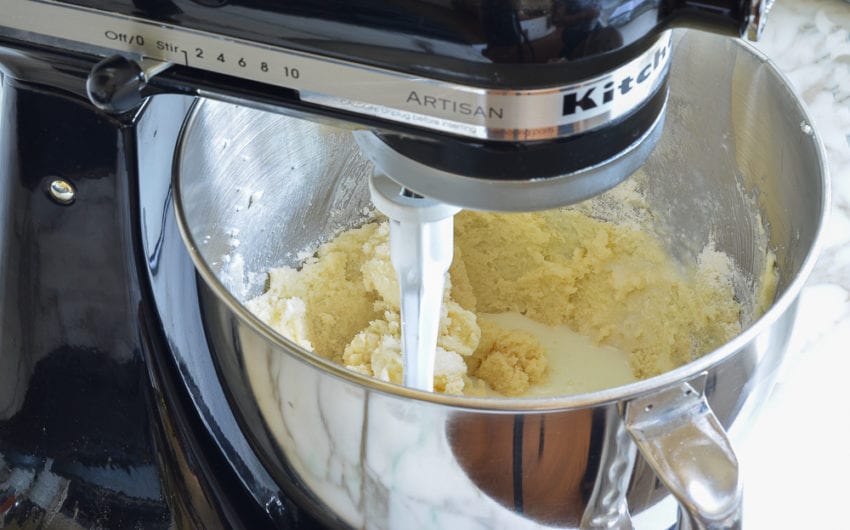 Milk mixture added to a stand mixer.