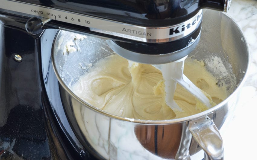 Smooth, light cake batter in a stand mixer.