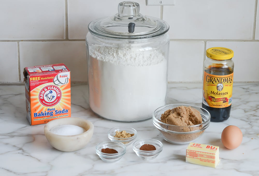 Gingerbread ingredients including baking soda, molasses, and butter.