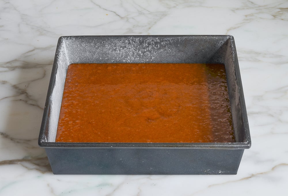 gingerbread batter in prepared pan ready to bake