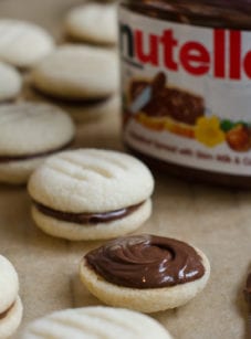 Jar of Nutella with Nutella cookies.