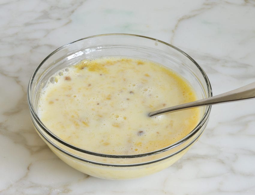 Milk and vanilla in a bowl with a banana mixture.