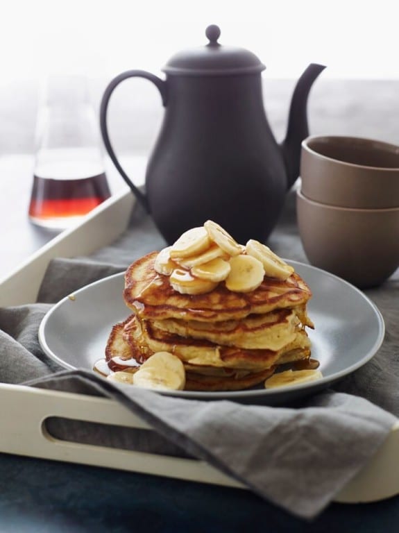 Stack of banana pancakes on a plate.