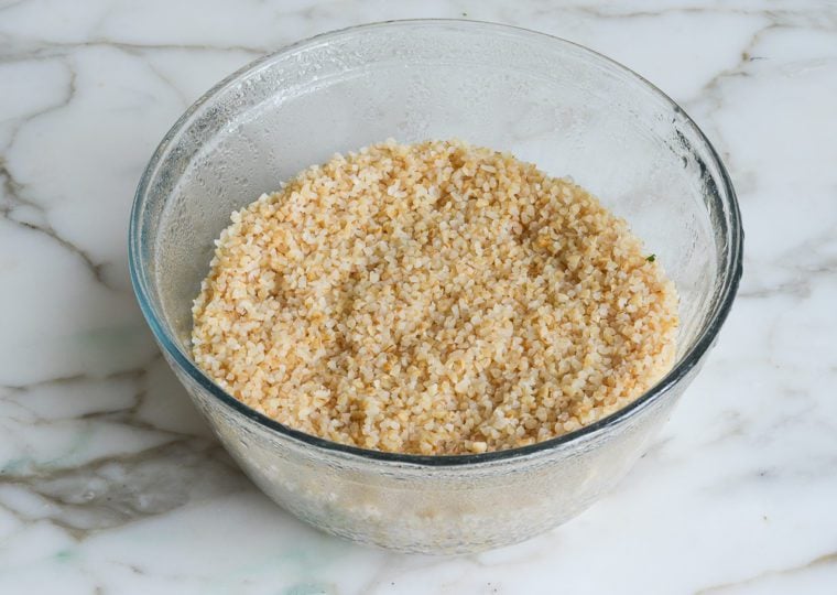 Glass bowl of steamed bulgur.