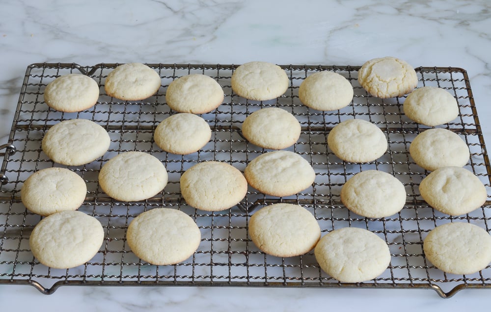 sugar cookies cooling on rack