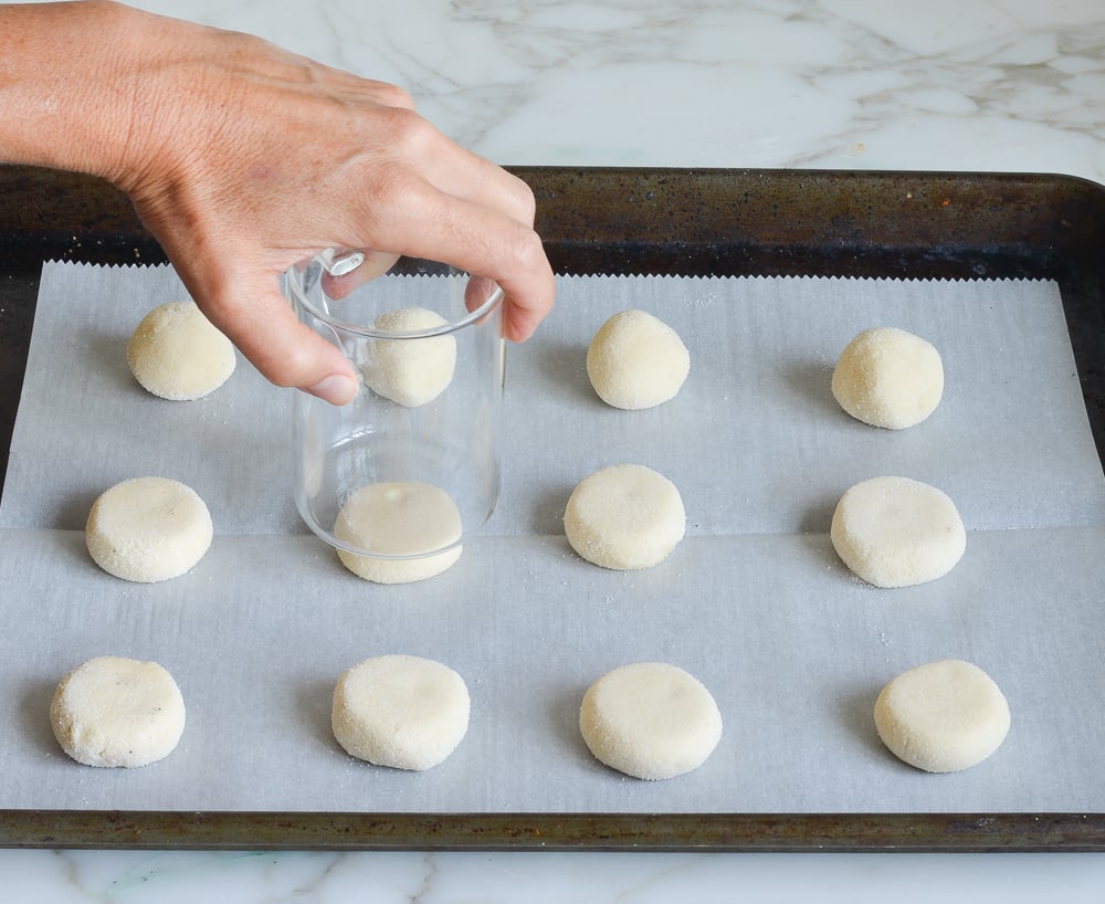 pressing the sugar cookies flat