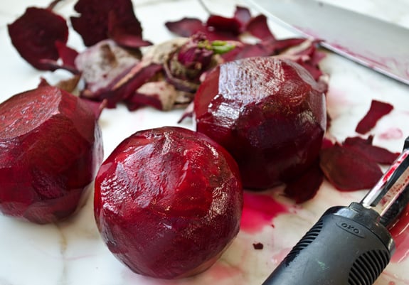 peeling-beets Peeled beets on a cutting board.