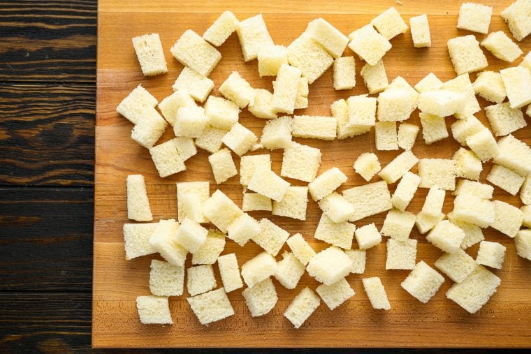 bread cubes on cutting board