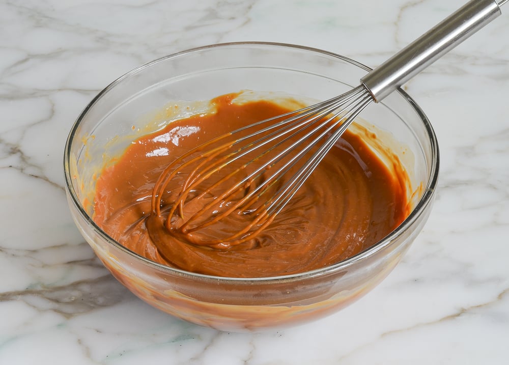 whisked dulce de leche glaze in mixing bowl