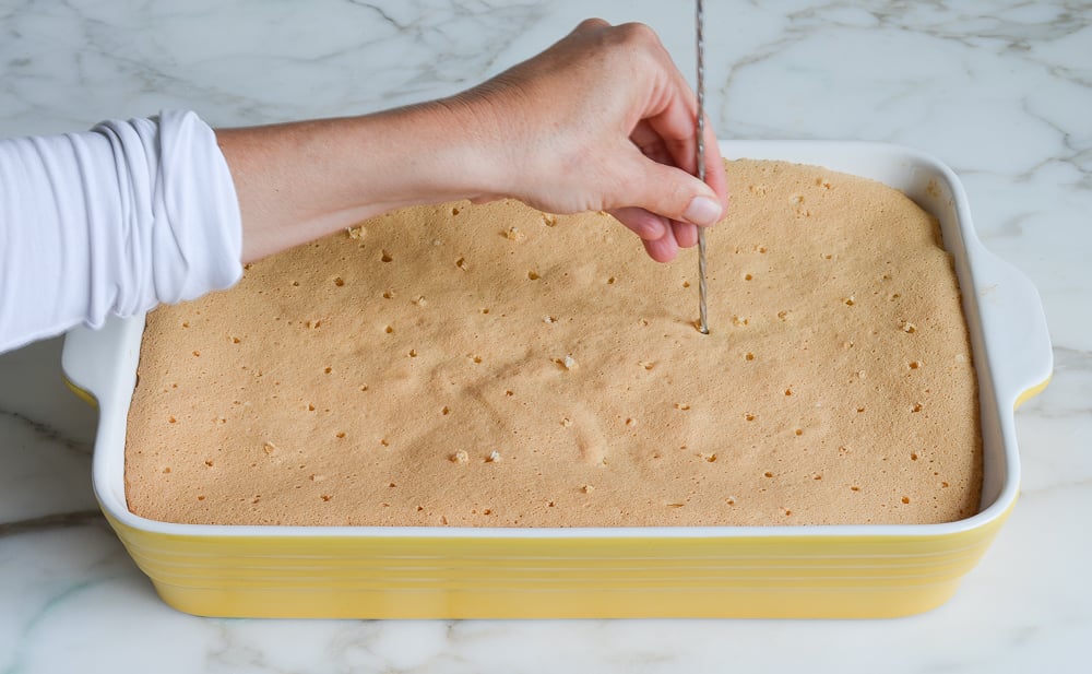 poking tres leches cake