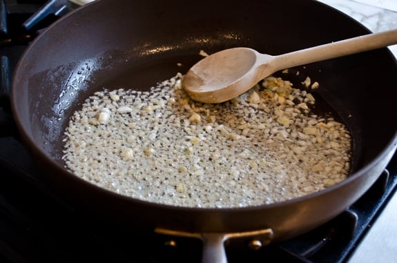 Ginger and garlic cooking in a skillet.