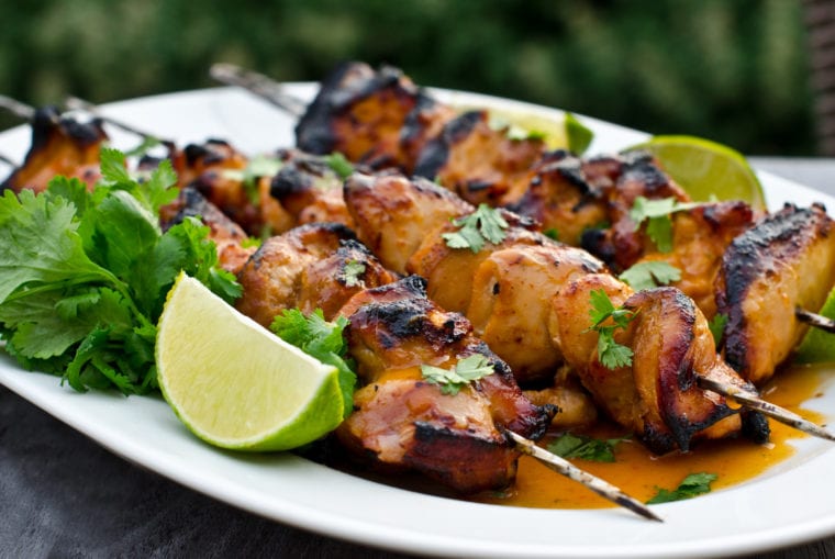 Platter of honey lime sriracha chicken skewers.