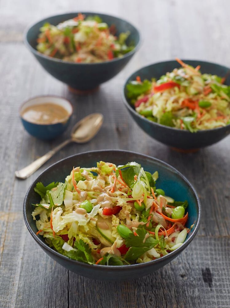 Bowls of Thai crunch salad with peanut dressing.