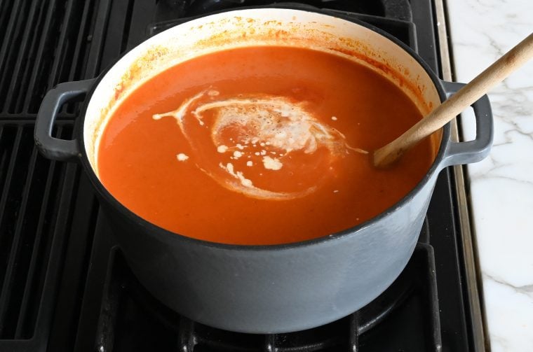 stirring in the heavy cream