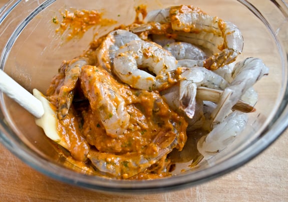 Shrimp and marinade in a bowl.