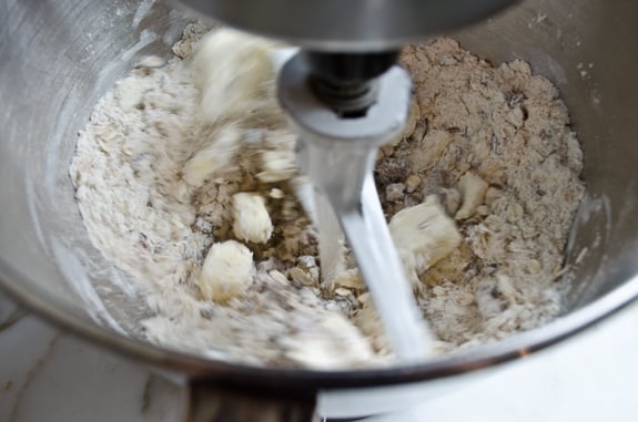 Stand mixer processing butter and dry ingredients.