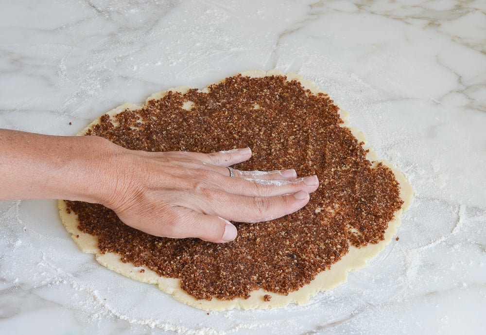 pressing the filling down to anchor it