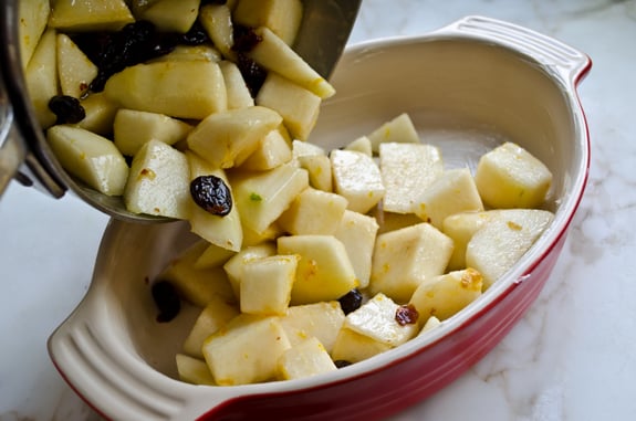 Pears pouring into a baking dish.