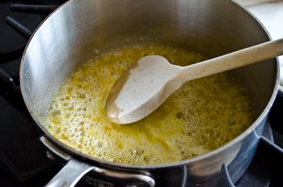 Sauce pan of boiling butter mixture.