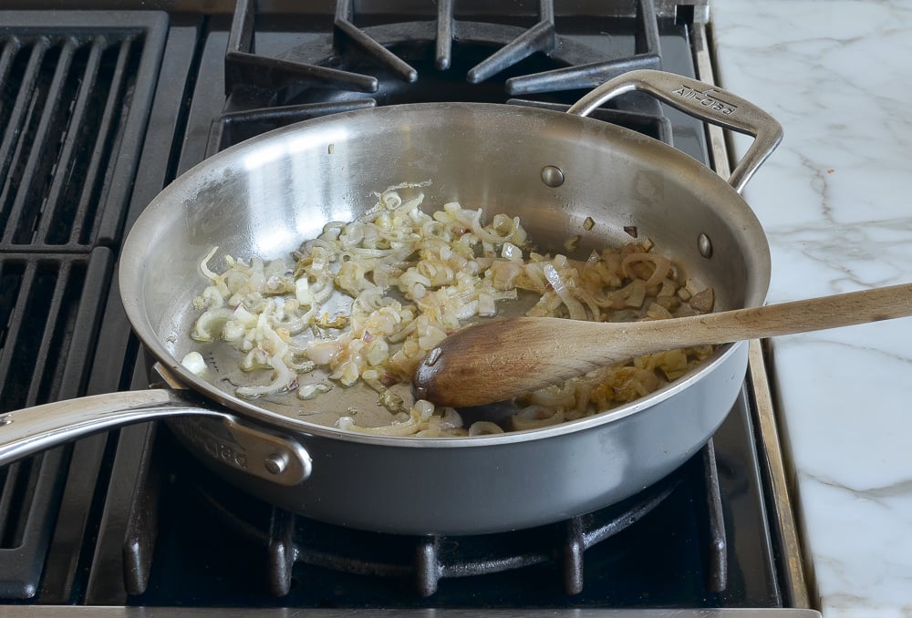 Cooked shallots in a skillet.