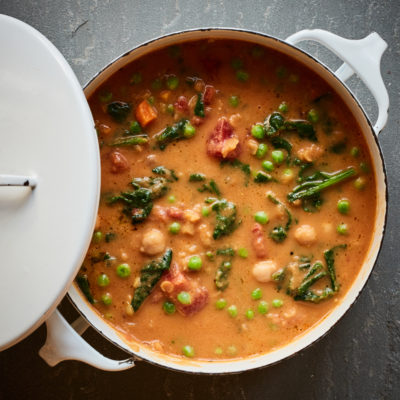 Pot of smoky chickpea, red lentil, and vegetable soup.