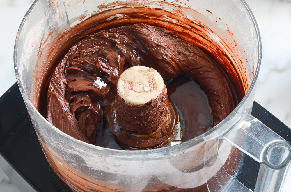 adding the corn syrup and vanilla to the chocolate frosting