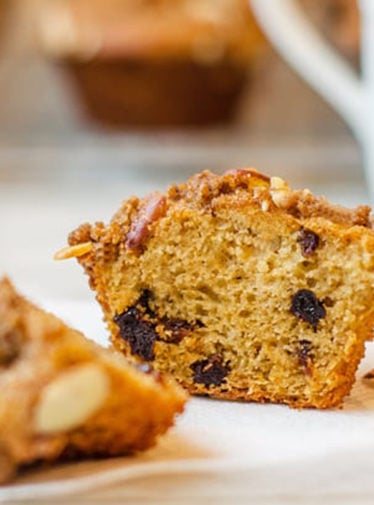 Dried cherry buttermilk muffin with almond streusel cut in half.