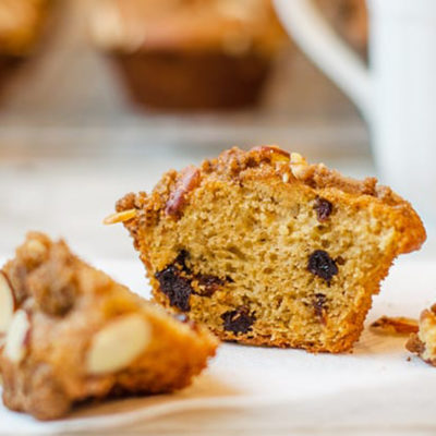 Dried cherry buttermilk muffin with almond streusel cut in half.