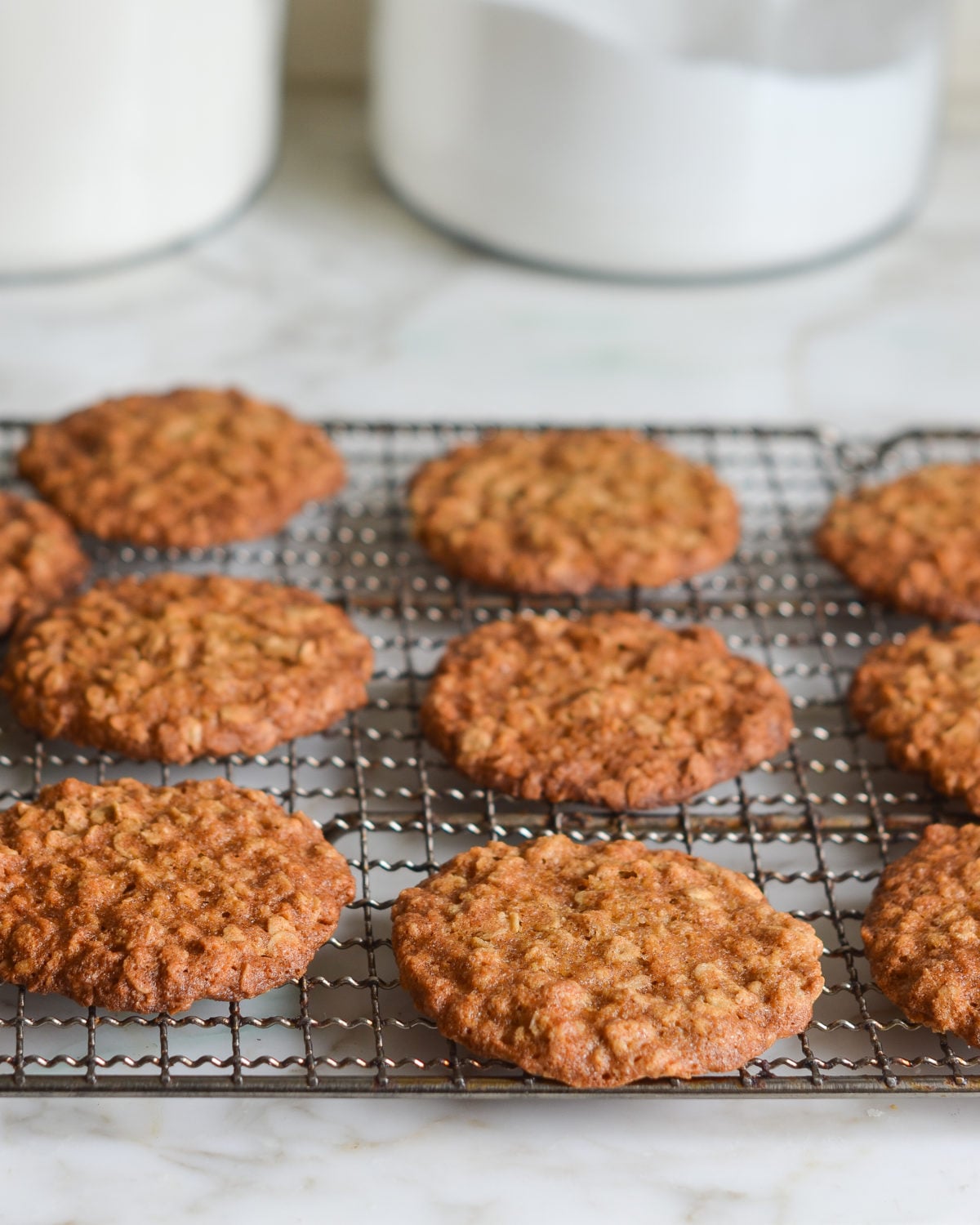 Thin and crispy banana oatmeal cookies on a wire rack.