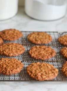 Thin and crispy banana oatmeal cookies on a wire rack.