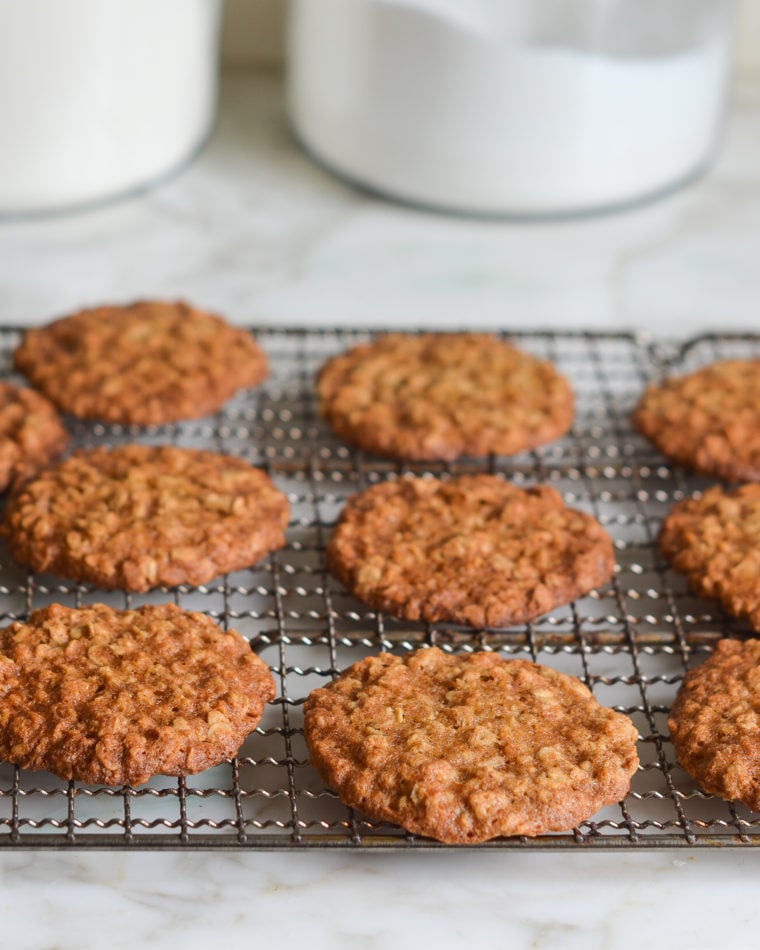Thin and crispy banana oatmeal cookies on a wire rack.